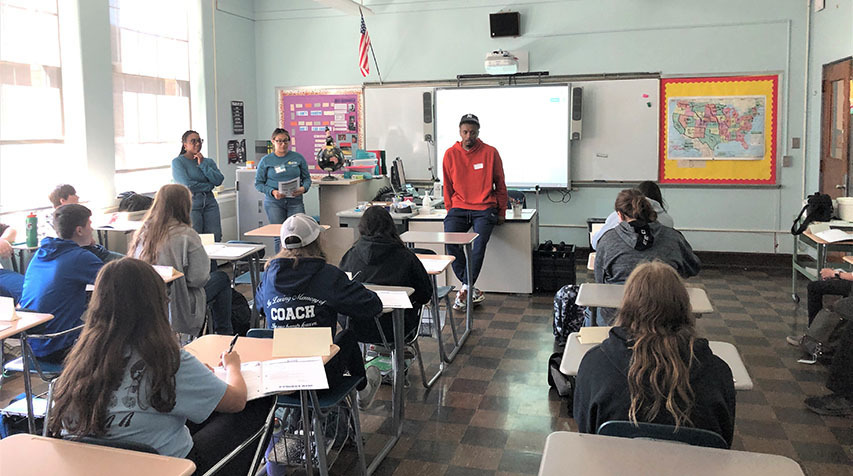 Elijah Hughes visits with the seventh and 10th grade health classes